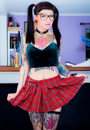 1 dark haired female tortures another during lezdom play in concrete cellar